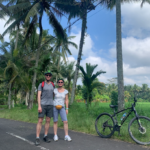 family cycling in ubud rice field kids cycling in ubud village