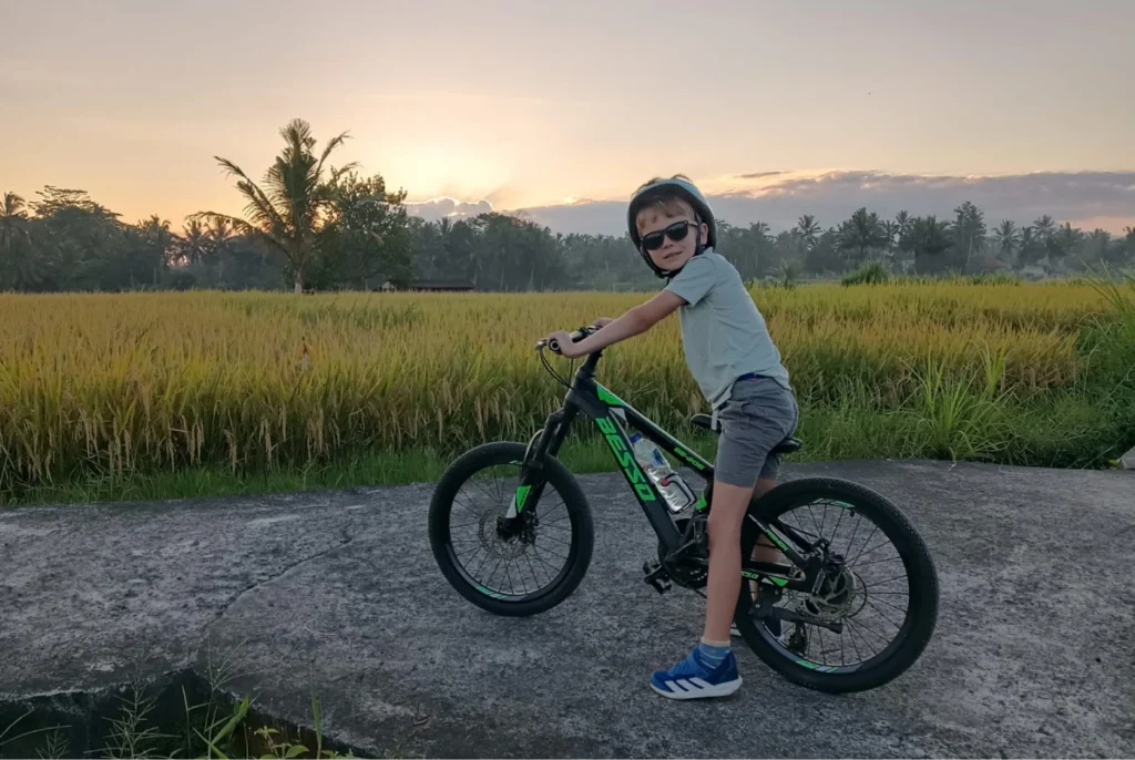 Family enjoying an Ubud bike tour with kids